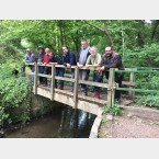 Some of the team on the bridge above the stream.