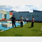 School staff setting out raised beds